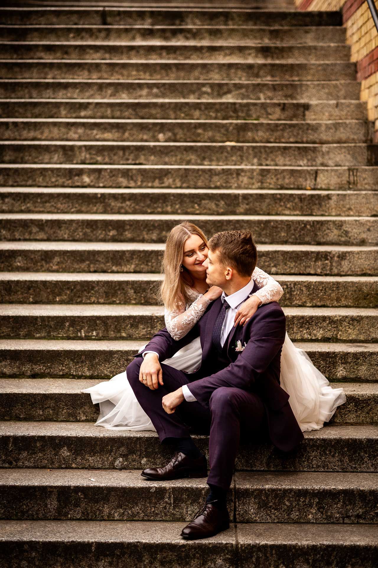 Romantic wedding couple shares intimate moments on vintage stone steps in progressive sequence.