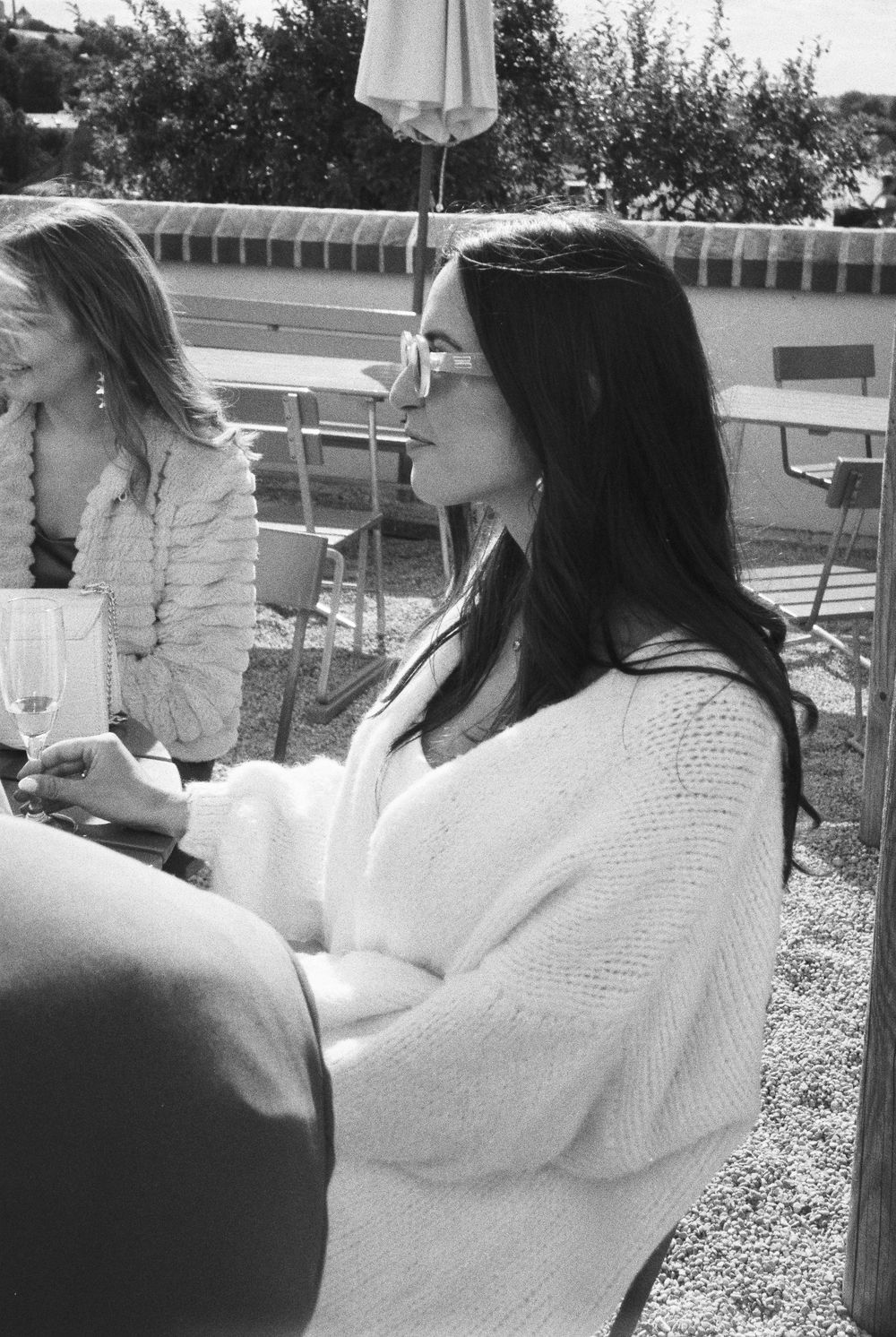 Black and white film wedding photograph capturing an intimate and emotional moment.