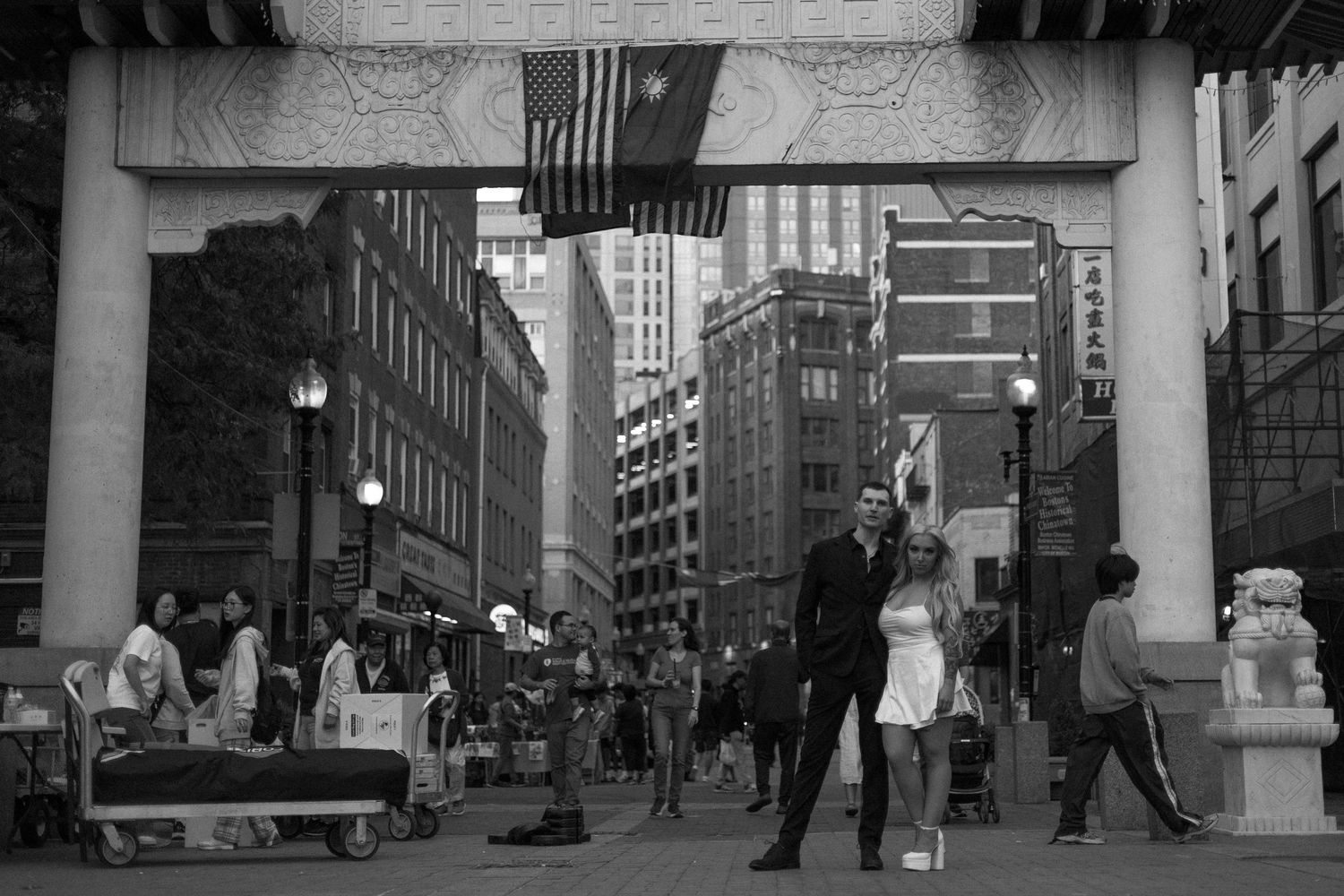A black and white photo montage shows multiple street scenes of vintage New York City with buildings and pedestrians.