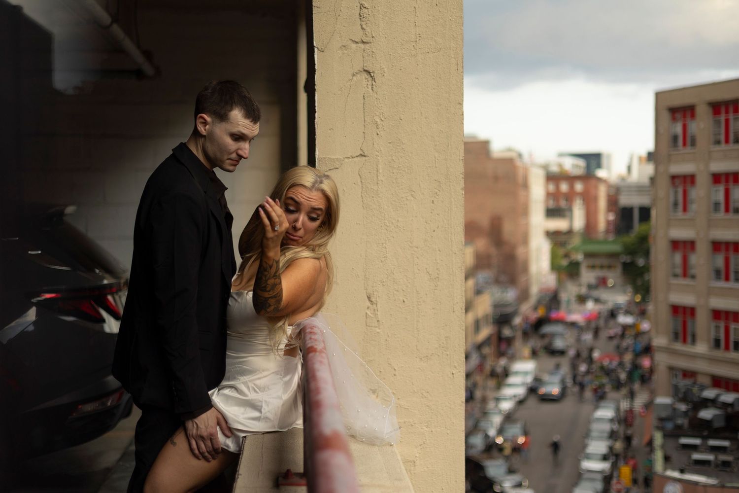 A series of intimate wedding photos showing tender moments between a couple against an urban backdrop.