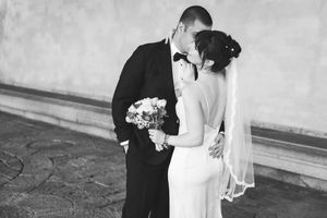 A black and white wedding photo collage showing romantic moments between a couple on their special day.