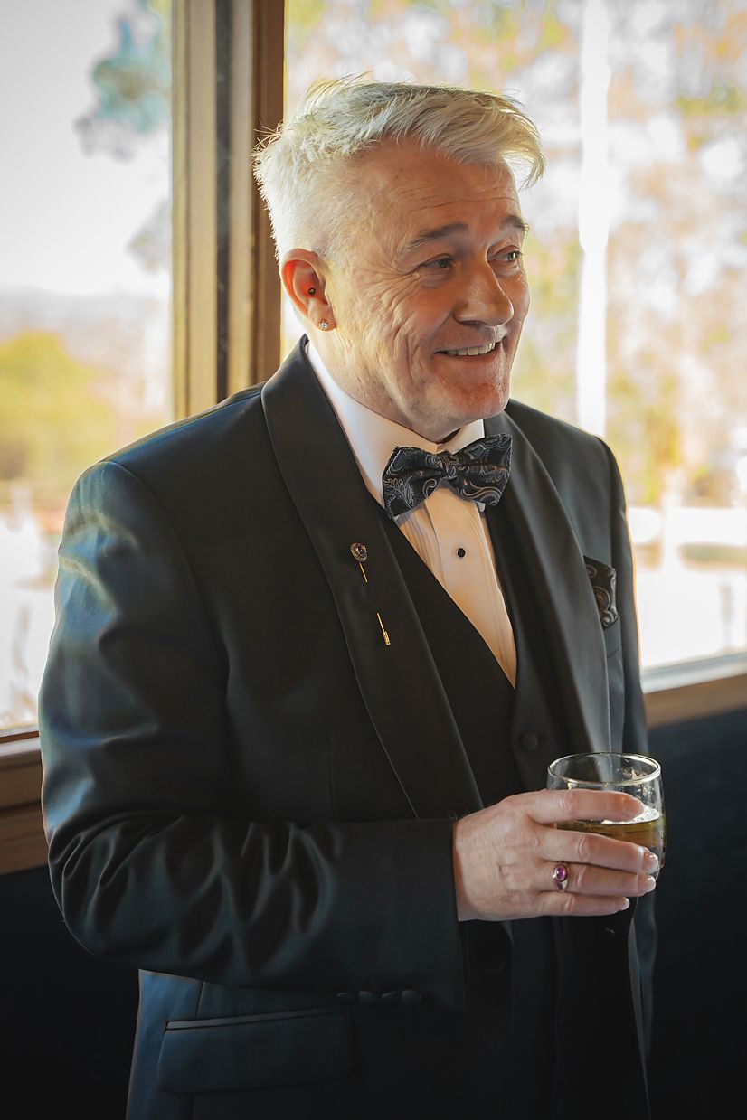 A sequence of candid moments showing people in black formal attire enjoying drinks indoors near a window.