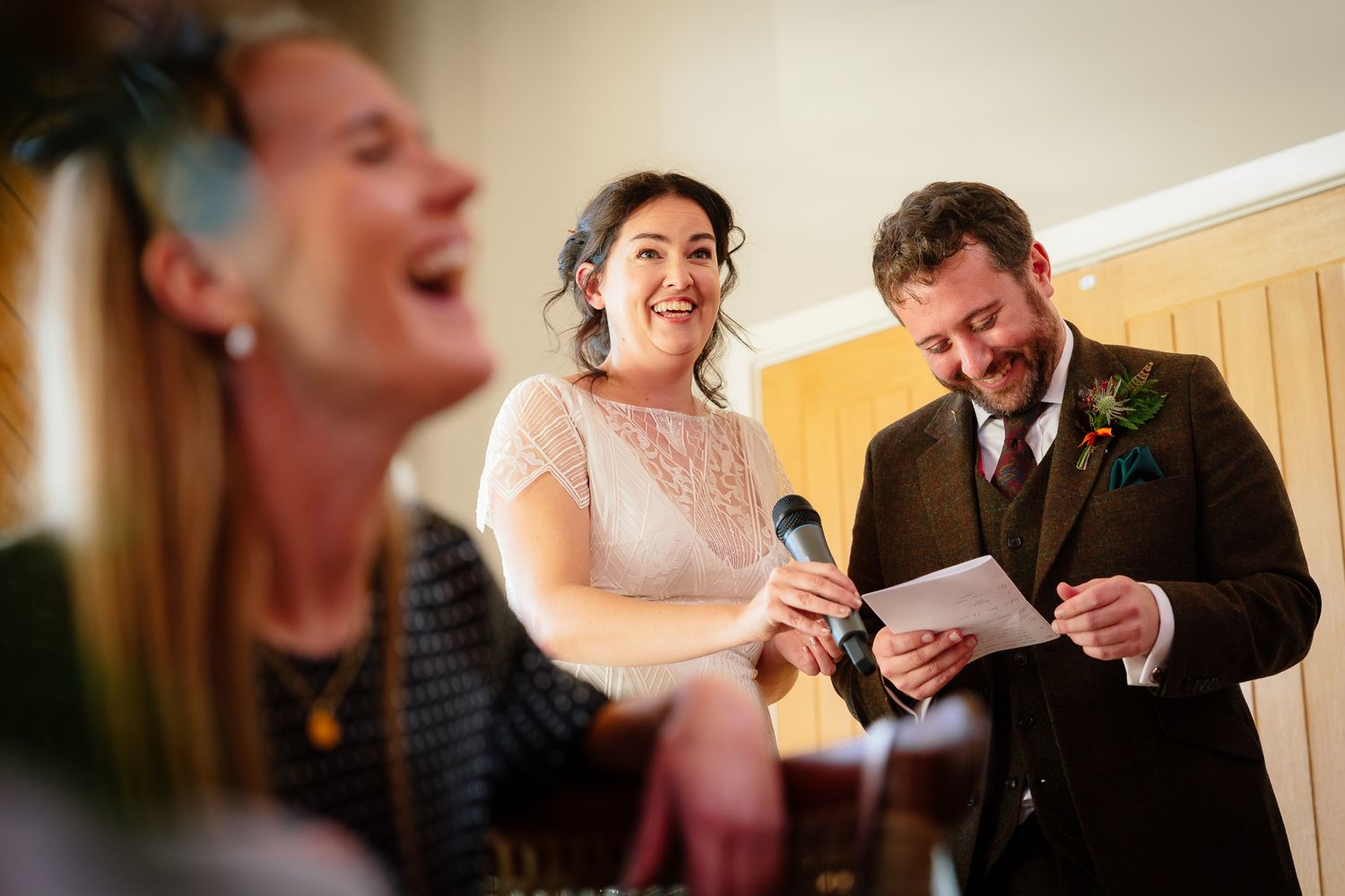 Candid laughter and joy captured during wedding celebration. Doxford Barns