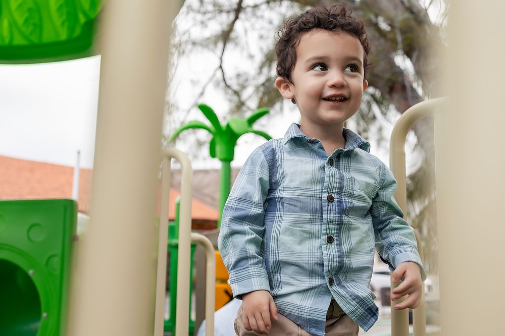 Smiling toddler portrait during a family session in Puerto Morelos