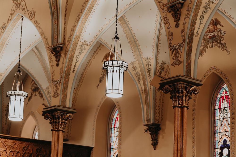 arches and light pendants glow in Immaculate Conception Catholic Church in Formosa Ontario