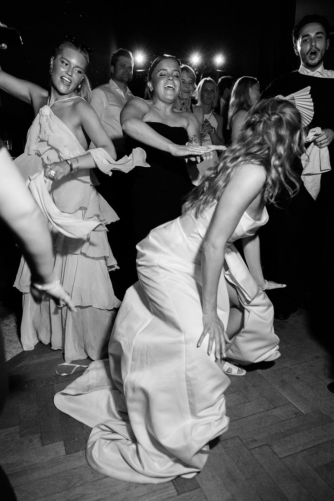 Black and white photos show couples dancing energetically at what appears to be a wedding reception or party.