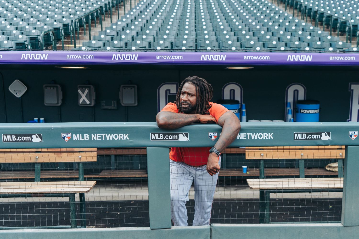 Empty stadium seats in light blue color create a geometric pattern at a baseball venue before a game.