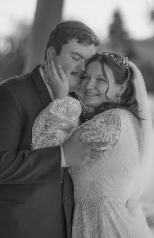 Black and white wedding portraits showing tender moments between newlyweds.