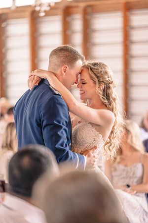 Romantic first dance moment captured in warm lighting at a wedding reception.
