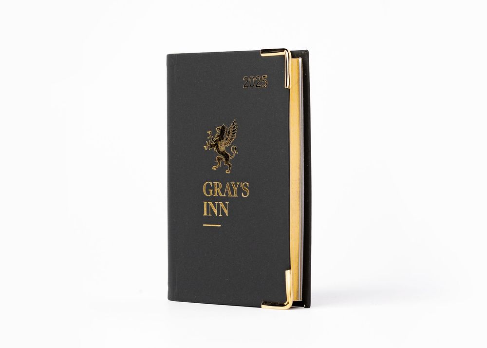 Black hardcover book with gold lettering and decorative elements shown from three different angles against white background.