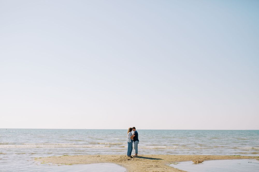 Scenic beach landscape with calm waters and clear blue sky.