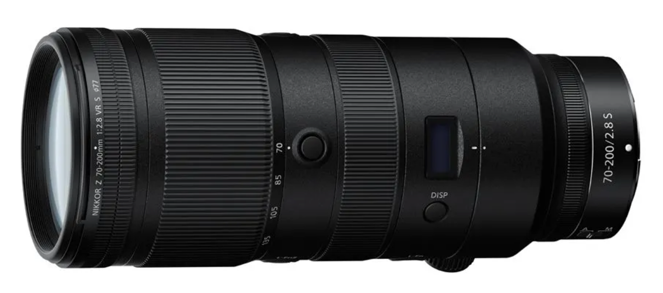 A collection of black professional telephoto camera lenses arranged in a row against a white background.