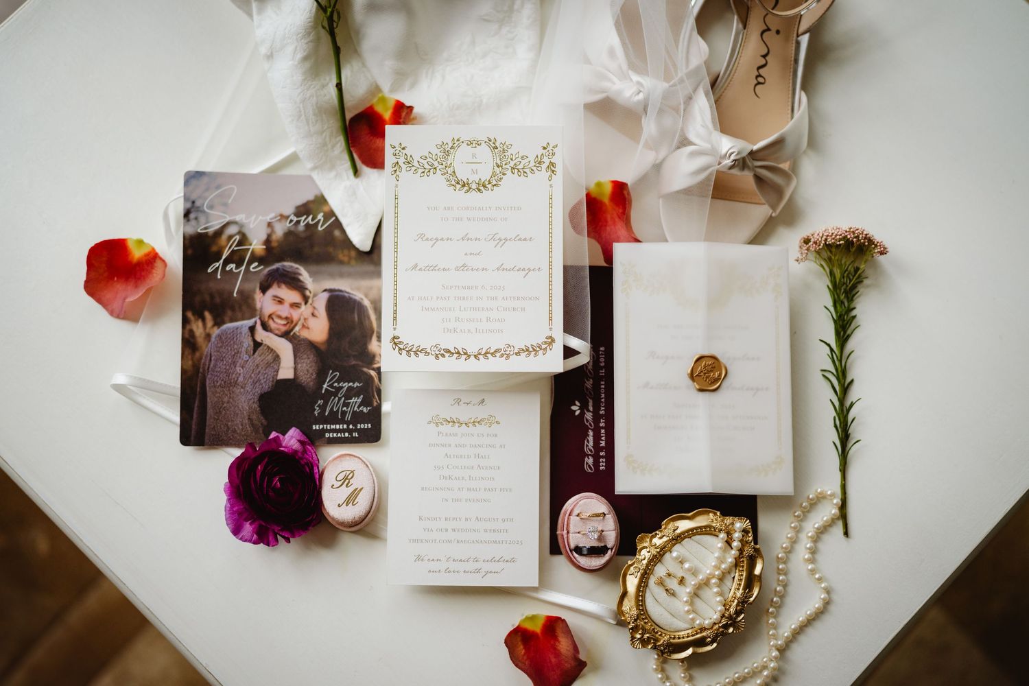 An elegant flat lay composition of wedding stationery with petals, floral elements and romantic details on a light background.