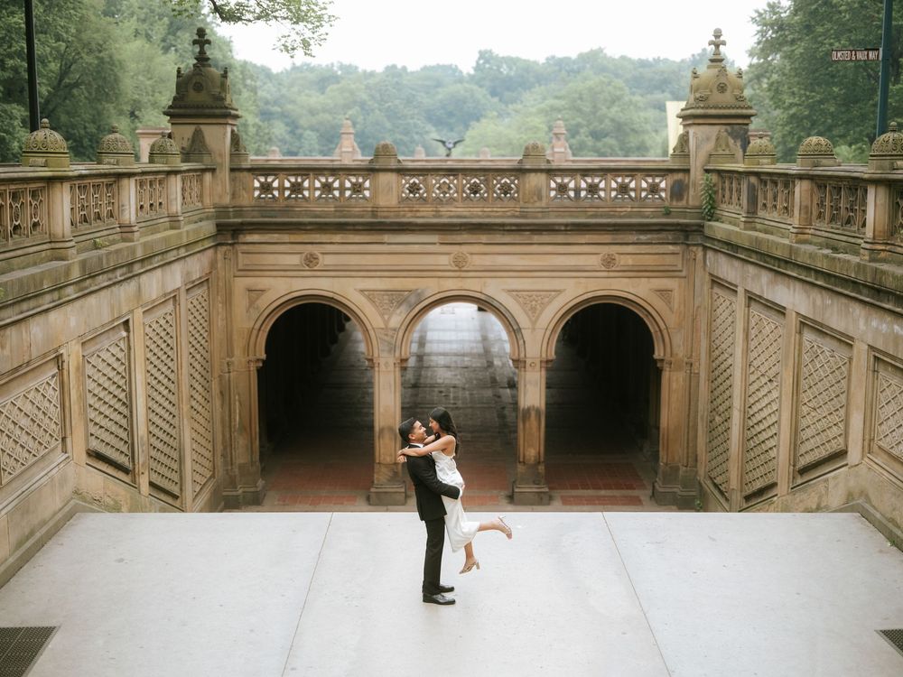 A wide view of an ornate stone terrace with architectural details.