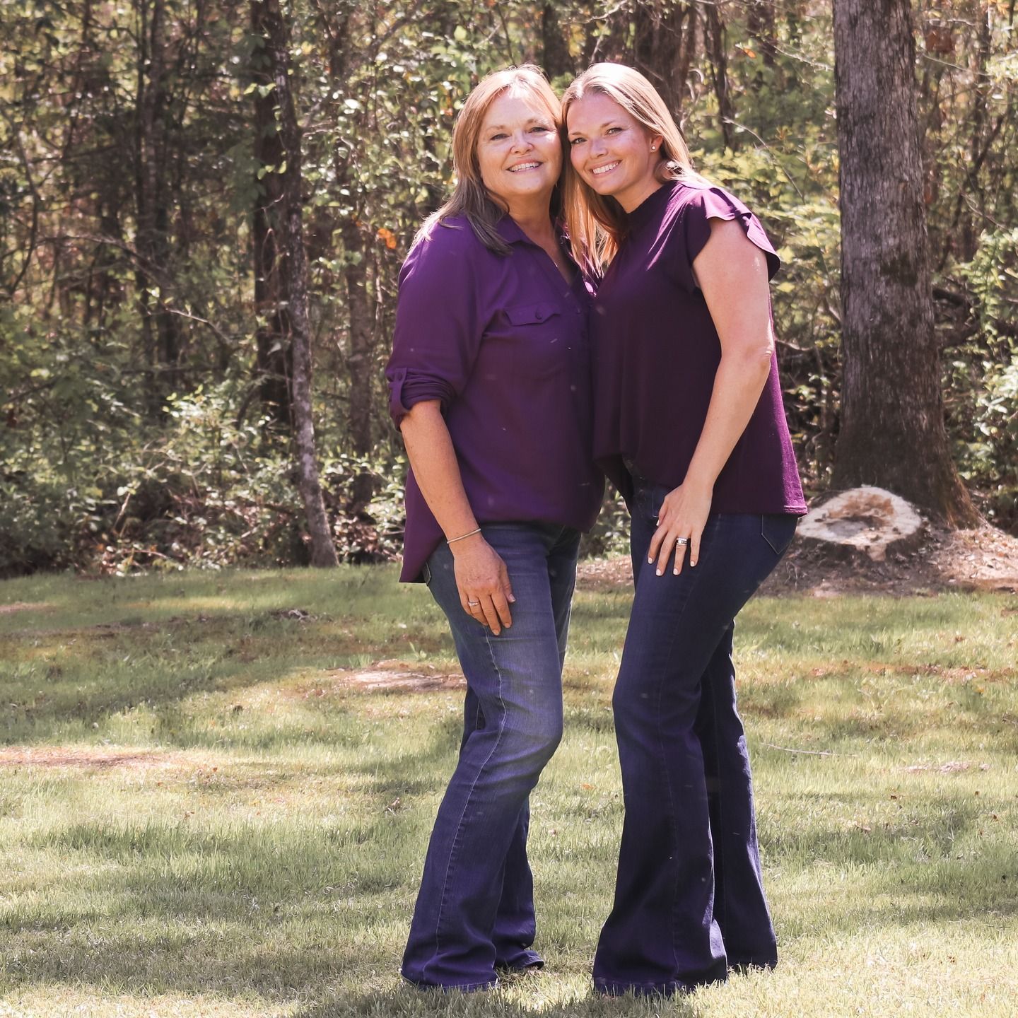 Six candid photos of people embracing and laughing together outdoors in a wooded grassy area.