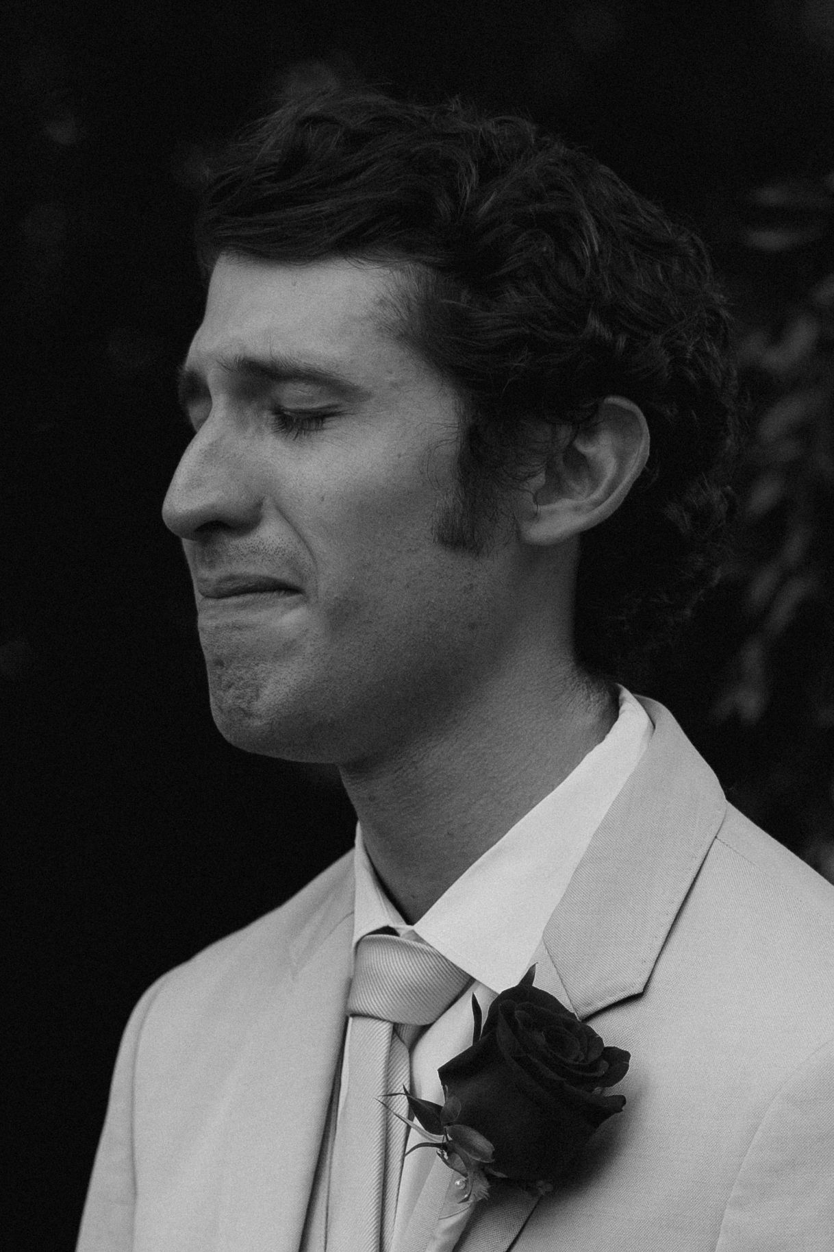 Black and white portrait series showing emotional expressions in formal attire.