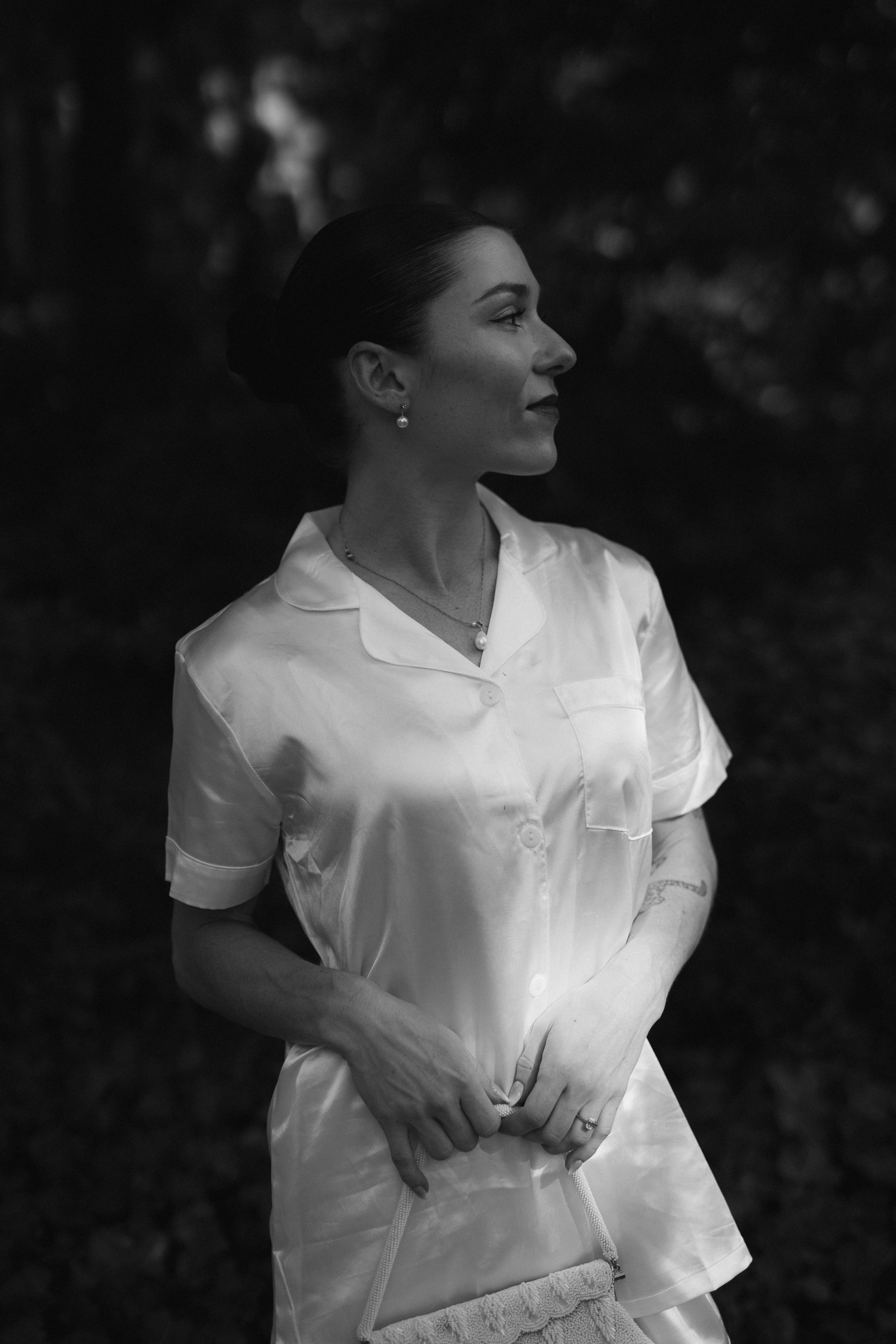 Black and white photo series of a woman in white dress spinning and twirling in elegant motion.