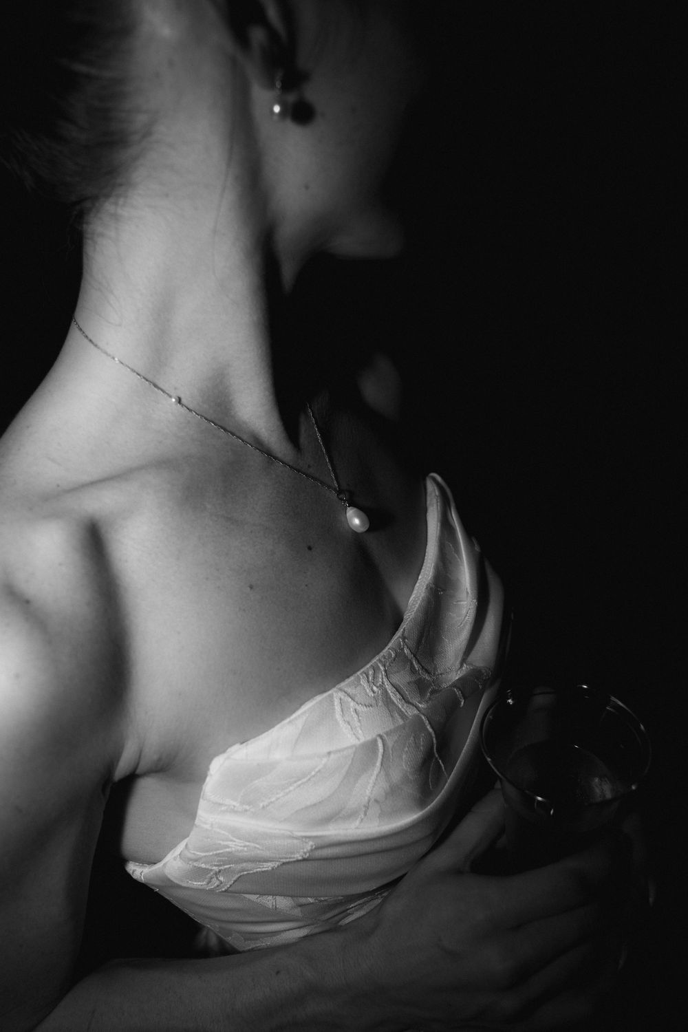Artistic black and white close-up detail shots of bridal attire.