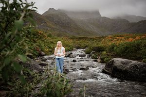 Senior photoshoot in the mountains by the river.