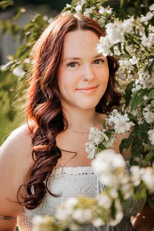 Senior portrait session in New Hampshire with summer bloom flowers.
