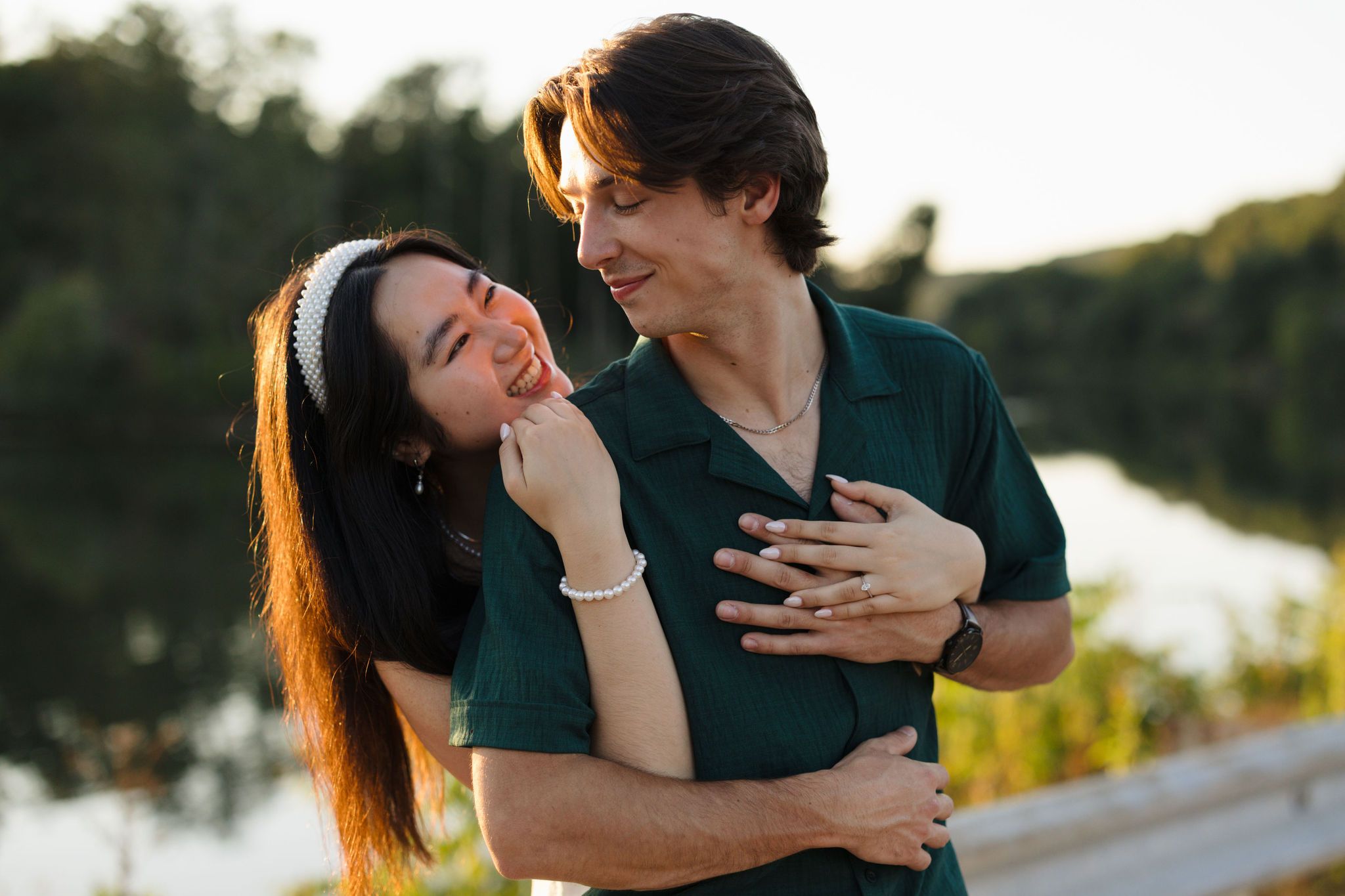 A tender romantic sequence of a couple embracing and kissing during golden hour outdoors.