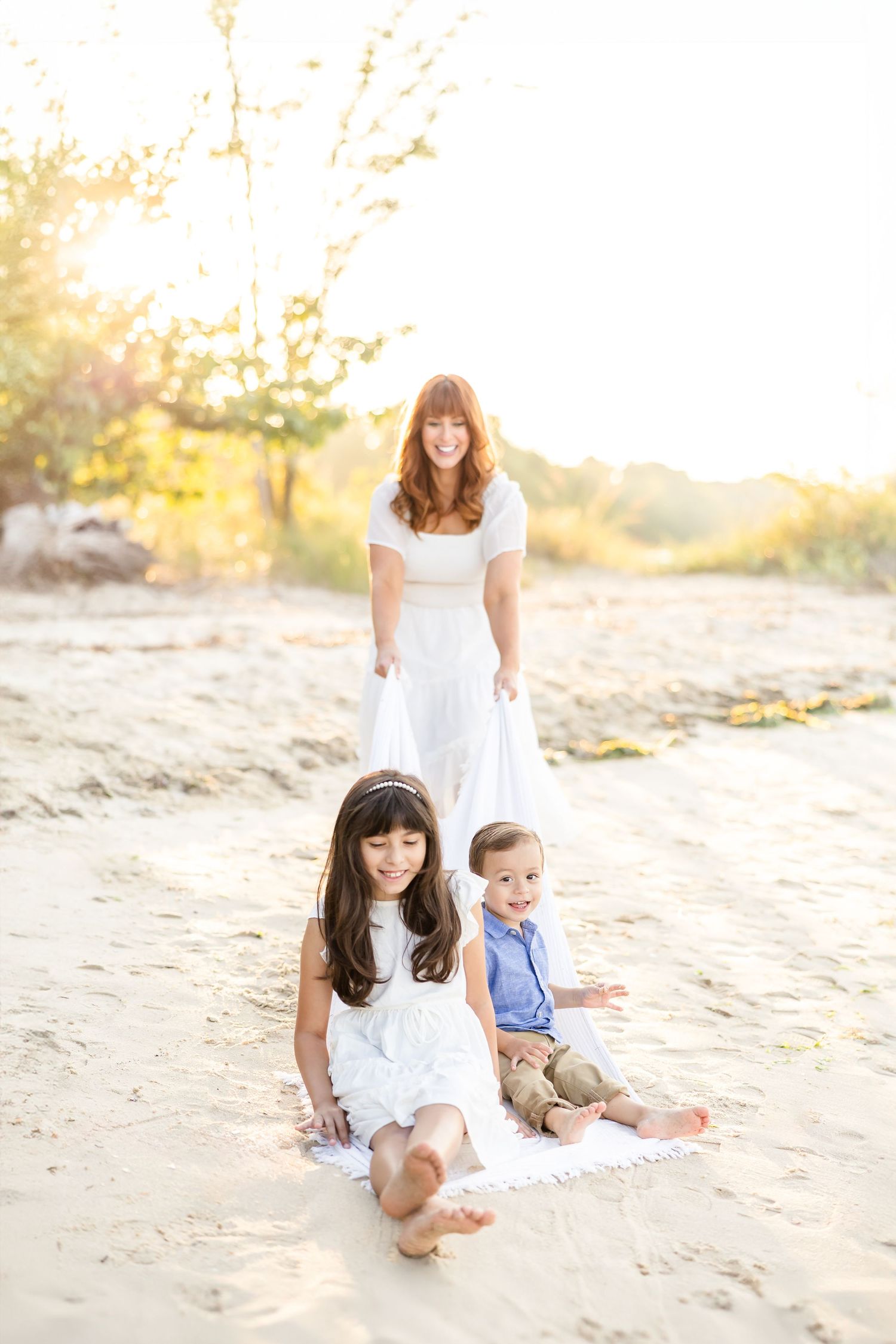 Sample photographs of a family photography session at Yorktown Beach in Virginia.