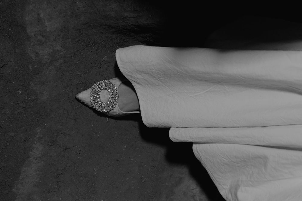 Black and white artistic photograph of flowing fabric.
