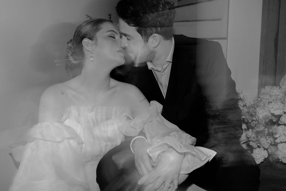Artistic black and white wedding photo sequence showing intimate moments between newlyweds.