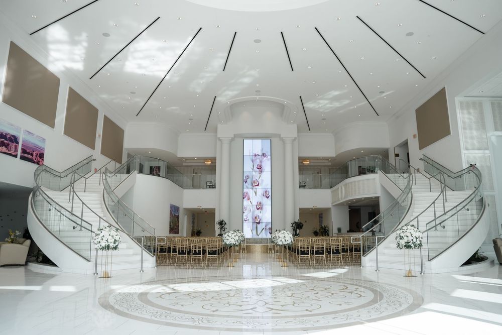 A panoramic collage of modern white interior spaces showing curved architectural elements and minimalist design features.