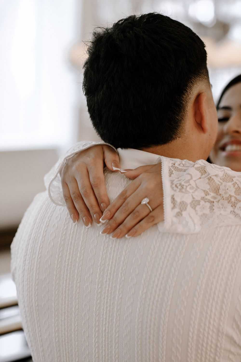 A person in a white textured garment showing selective focus and repetitive patterns across four similar images.