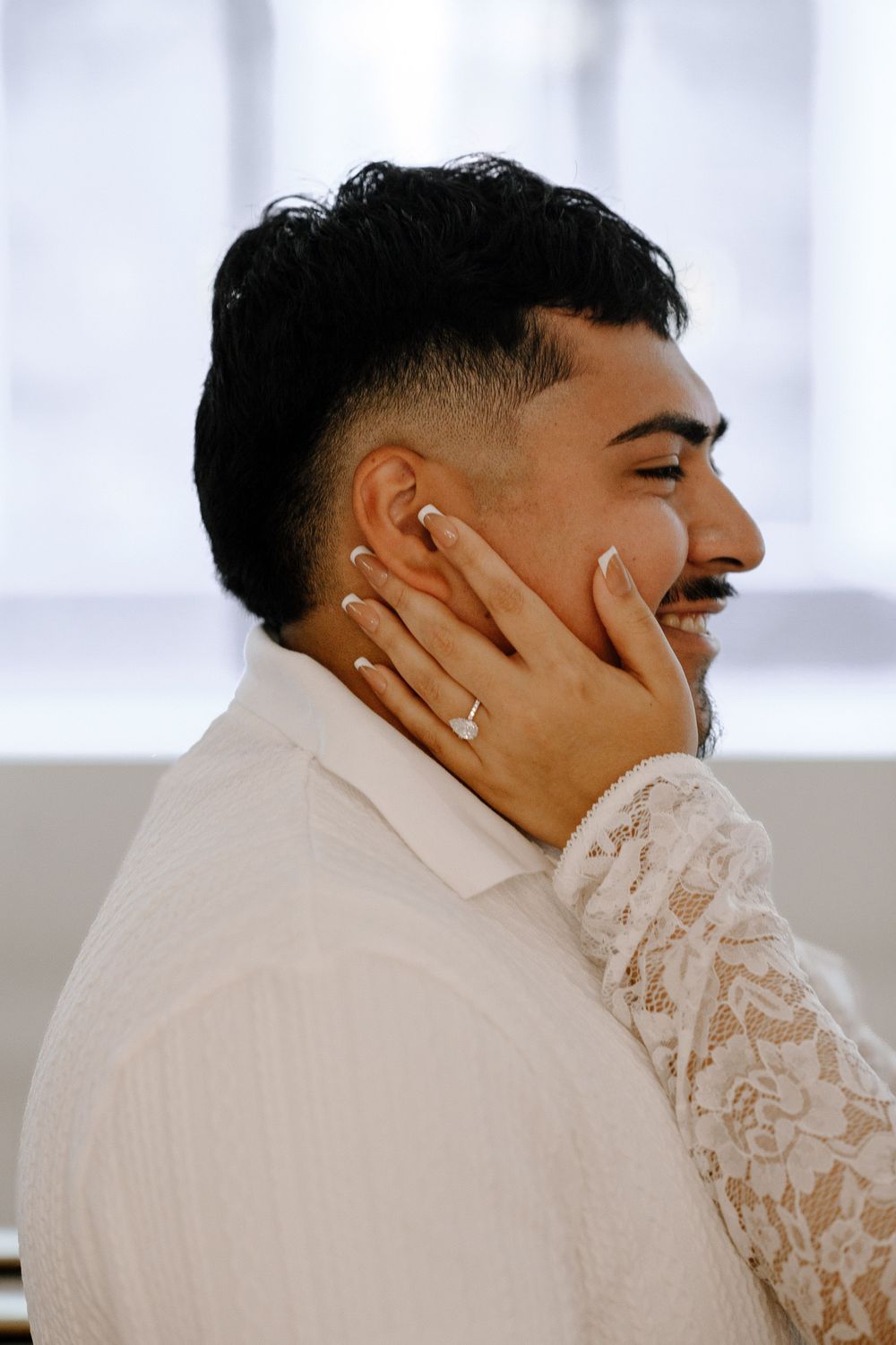 Side profile shots capture a joyous moment of genuine laughter with white lace details visible.