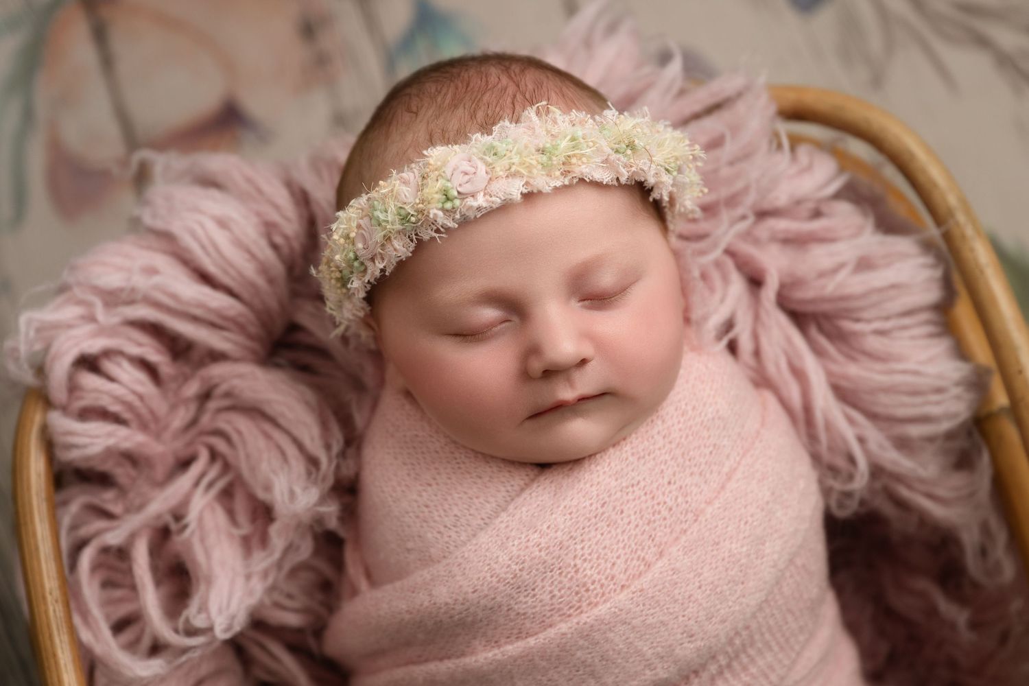 A series of delicate newborn baby portraits showing soft pink fabrics and lace headbands against a neutral background.