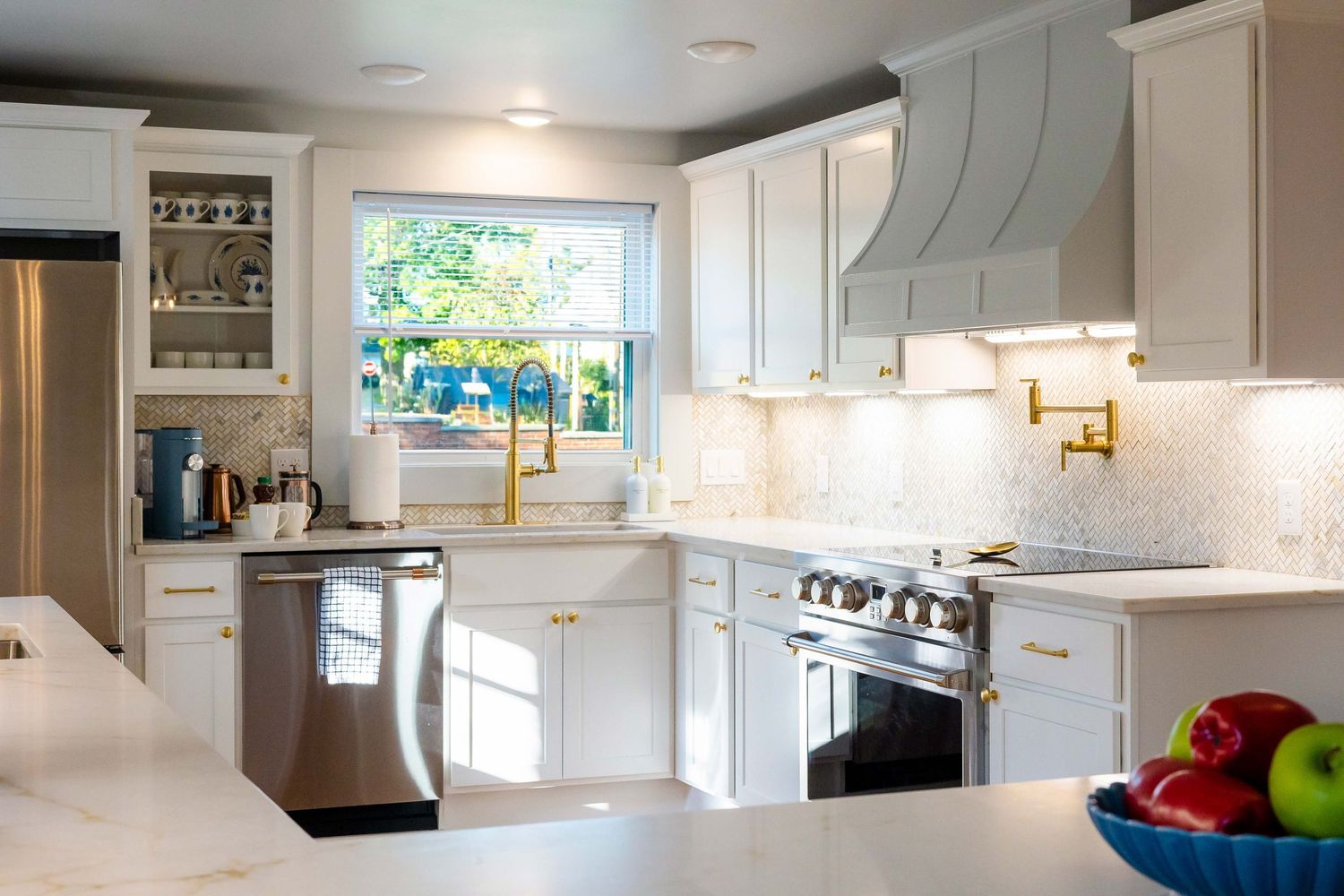 A collage of modern bright white kitchen interior design photos showing cabinets, countertops and appliances.