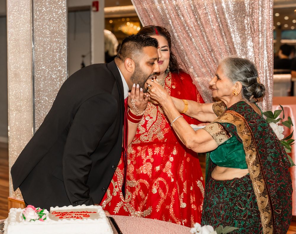 Wedding party celebrating with glitter and confetti during reception in elegant venue.