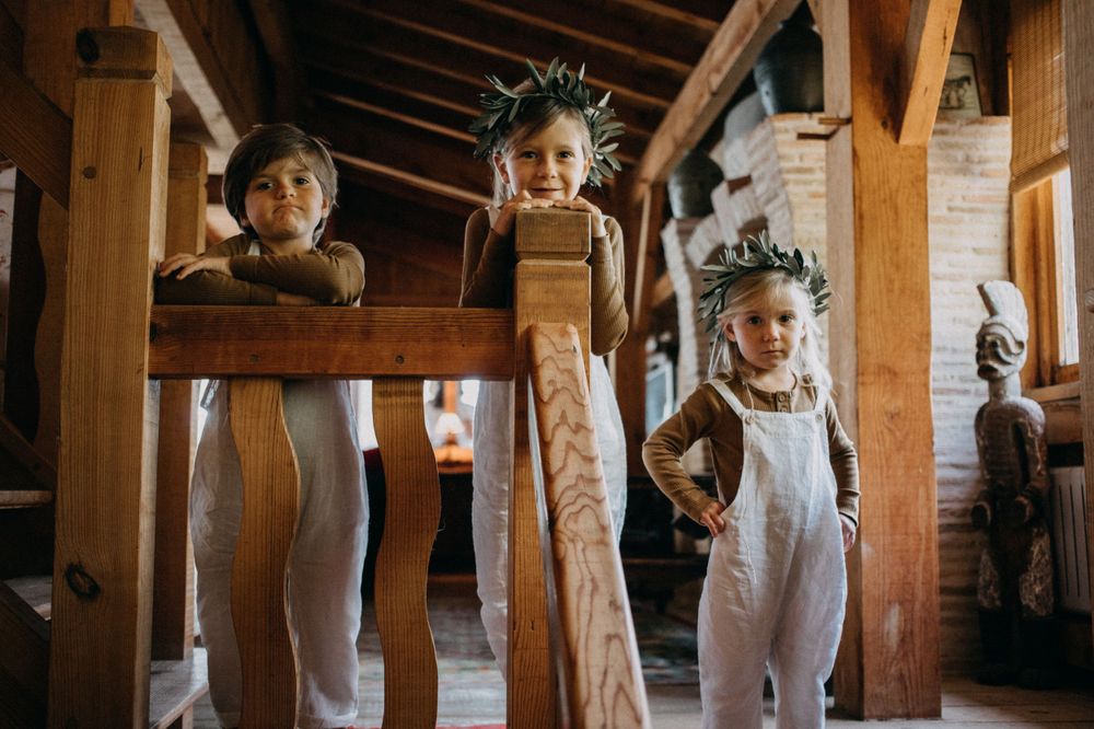 Interior of a wooden cabin with rustic wooden beams and decor.