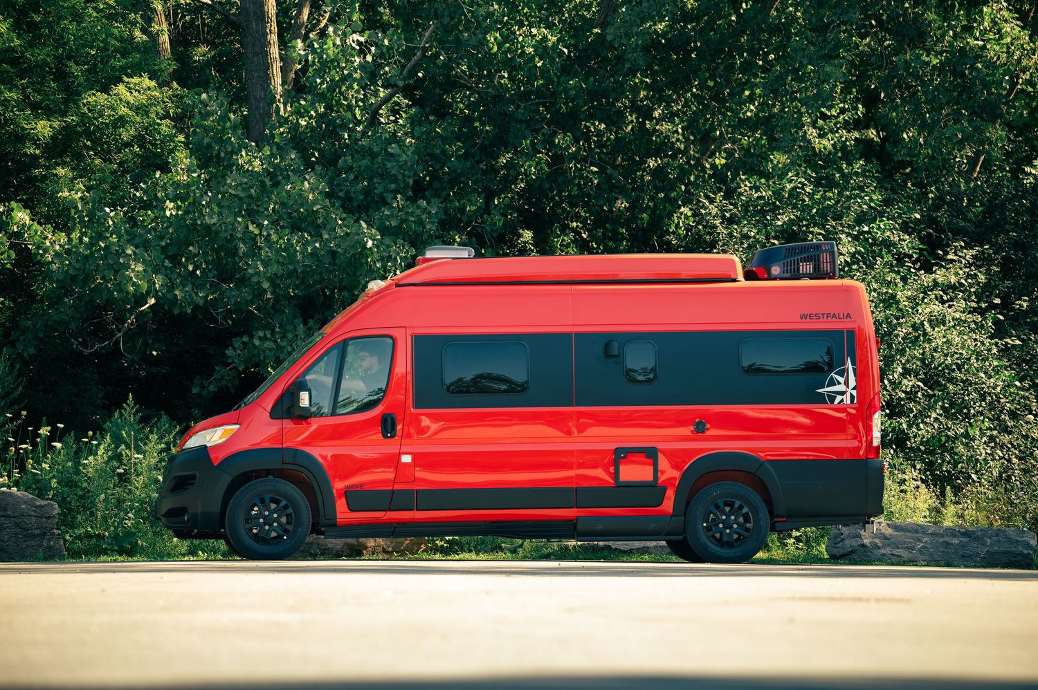 Long red stretch limousine vehicle photographed from different angles against a natural outdoor backdrop.