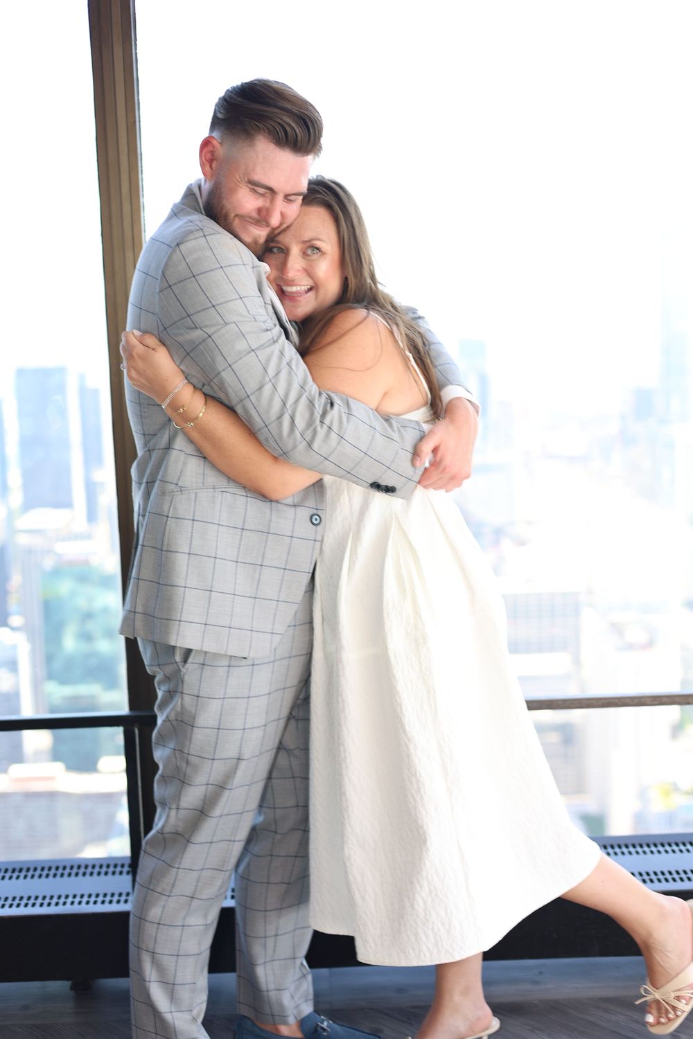 Dancing couple in formal attire share intimate moments in a series of romantic poses by a window.