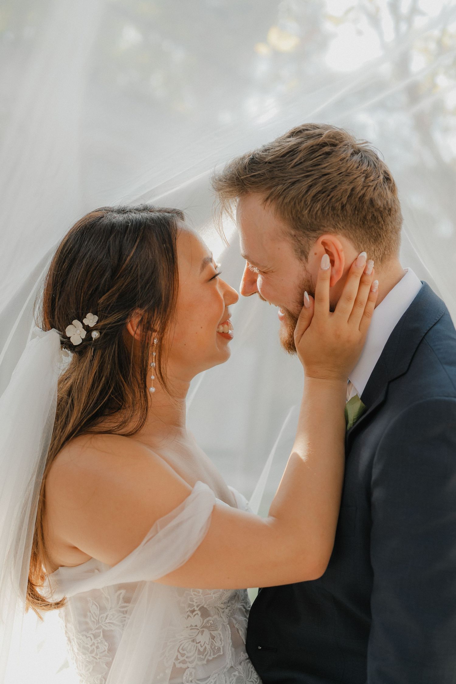 An intimate wedding portrait capturing a romantic moment between the newlyweds.