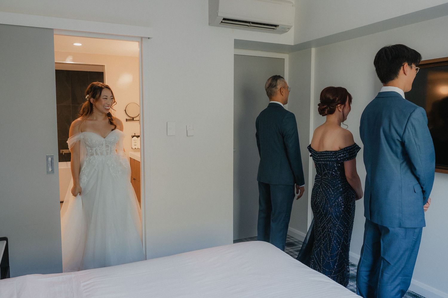 Five photos displayed in sequence showing wedding preparations in a bright indoor setting with people in formal attire.