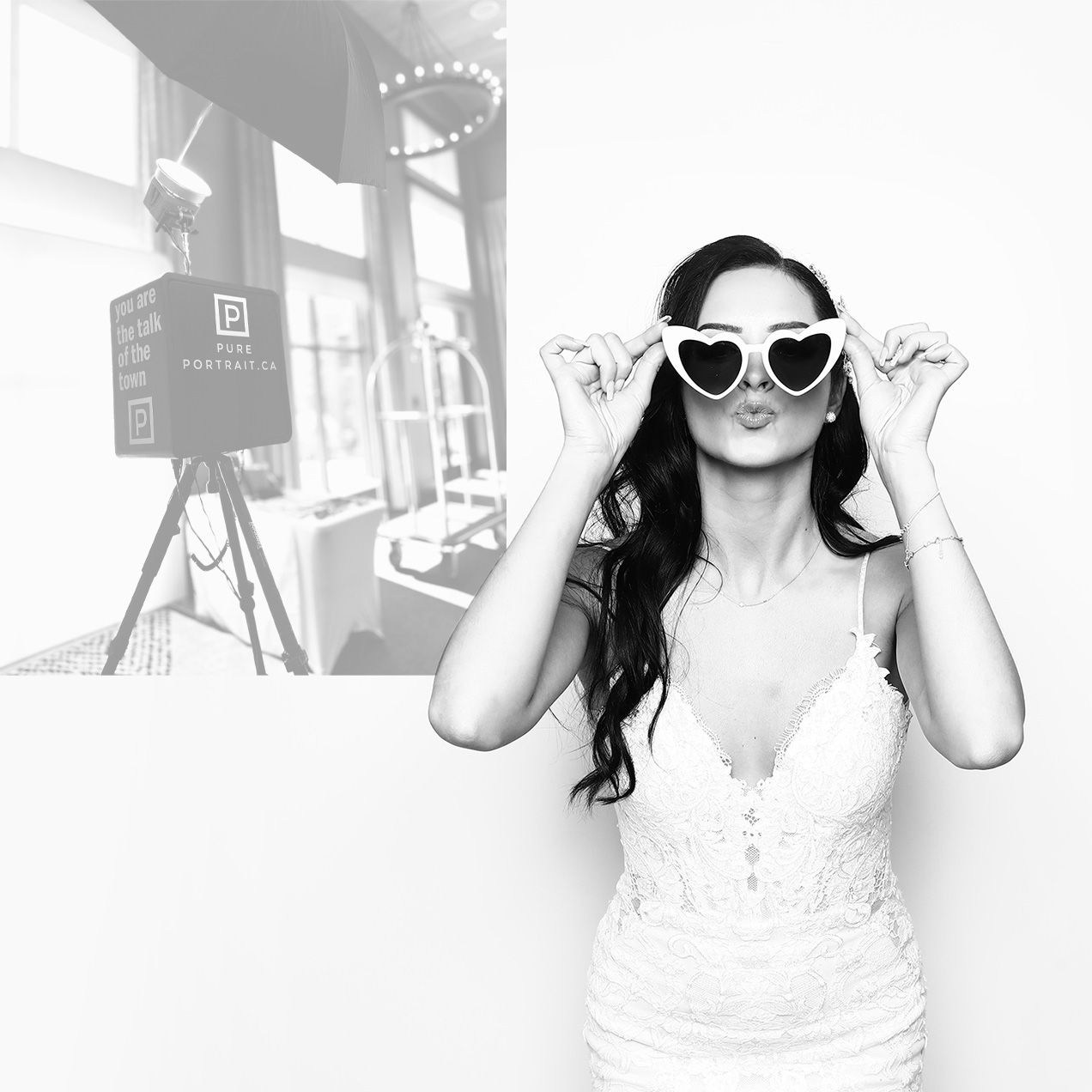 Black and white retro photo of person in white dress and sunglasses posing with vintage camera equipment.
