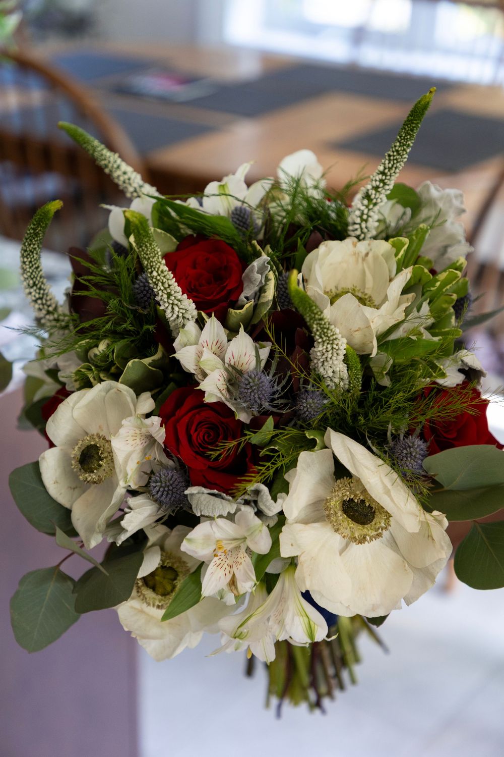 Bridal bouquet with red, white and blue florals.