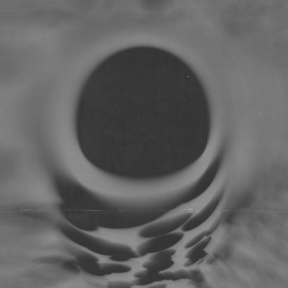Minimal black and white abstract art series showing a gradient eclipse effect with soft shadow transitions.
