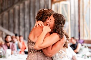 mother and daughter embrace during emotional parent dance at Sanaview Farm wedding