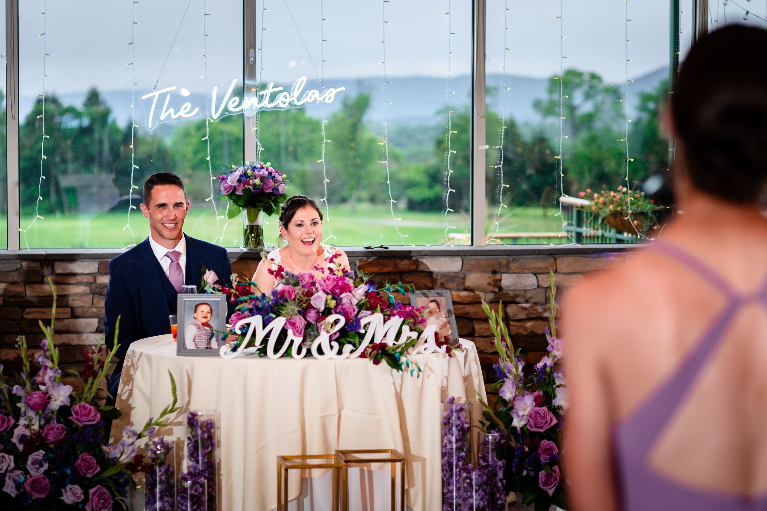 Wedding reception decor featuring elegant table settings and floral arrangements.