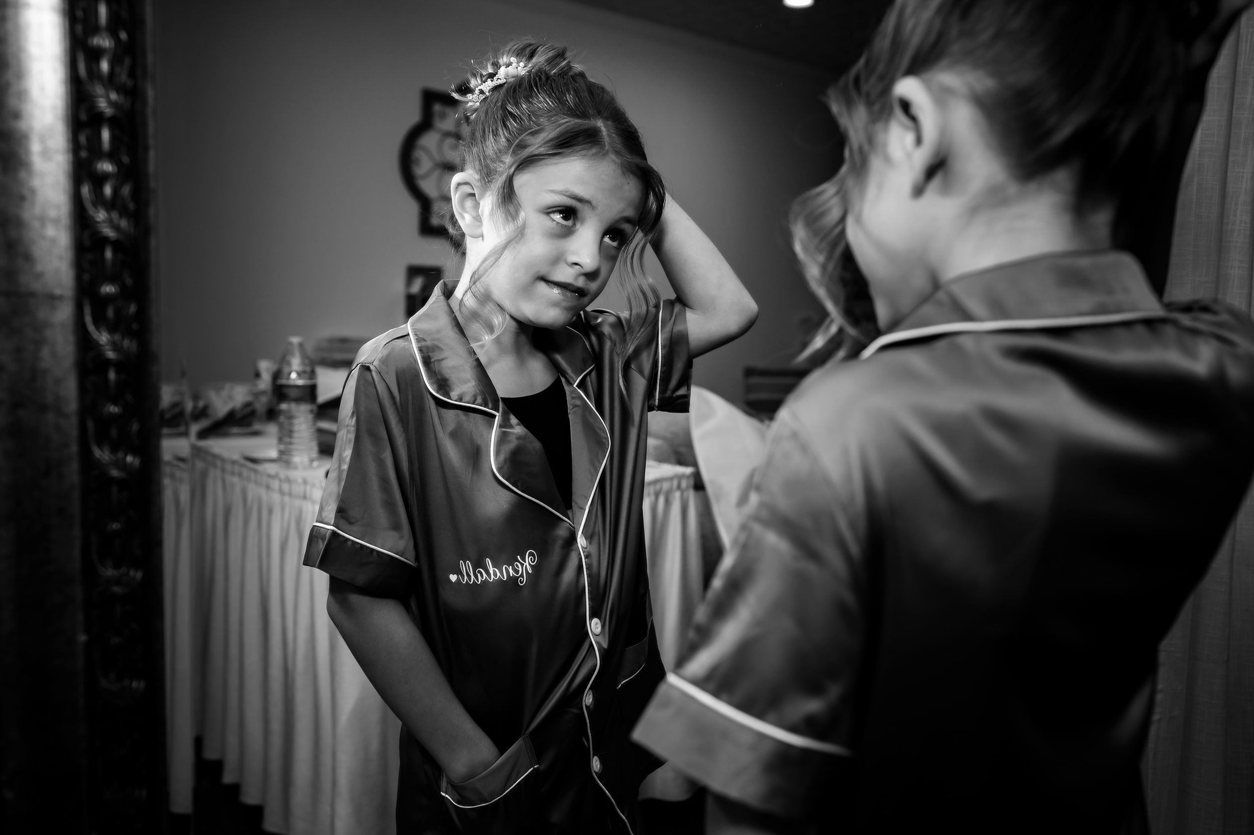 Artistic black and white photographs showing wedding morning preparation activities.