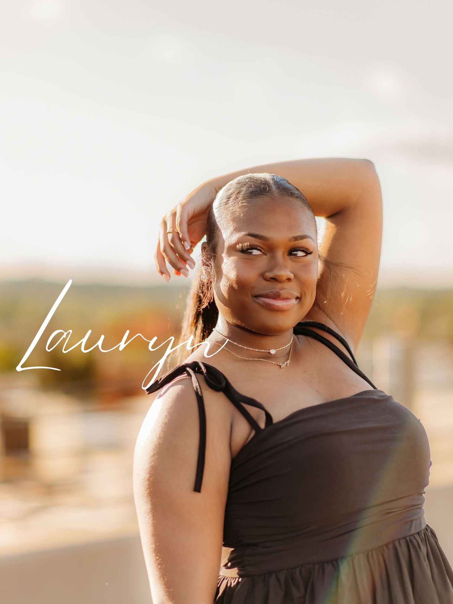 Person in a black dress poses with arm raised, photographed during golden hour with stylized text overlay.