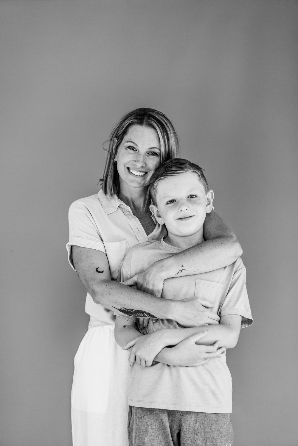 A heartwarming black and white photo series showing tender moments between two people embracing in different poses.