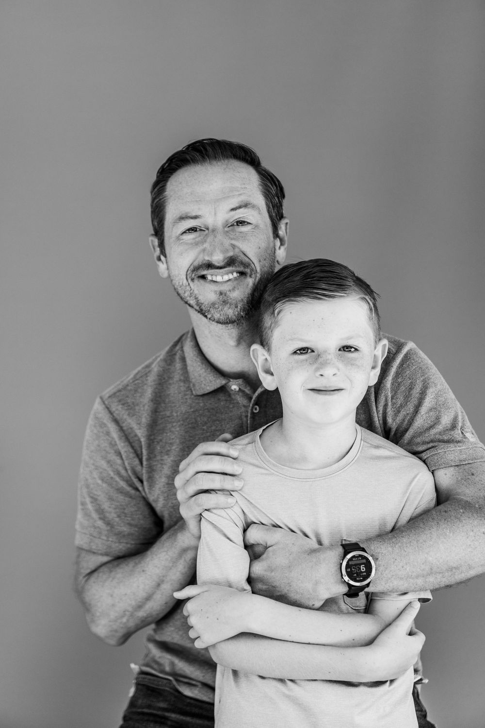 A heartwarming series of black and white portraits showing joyful moments between an adult and child embracing and smiling.