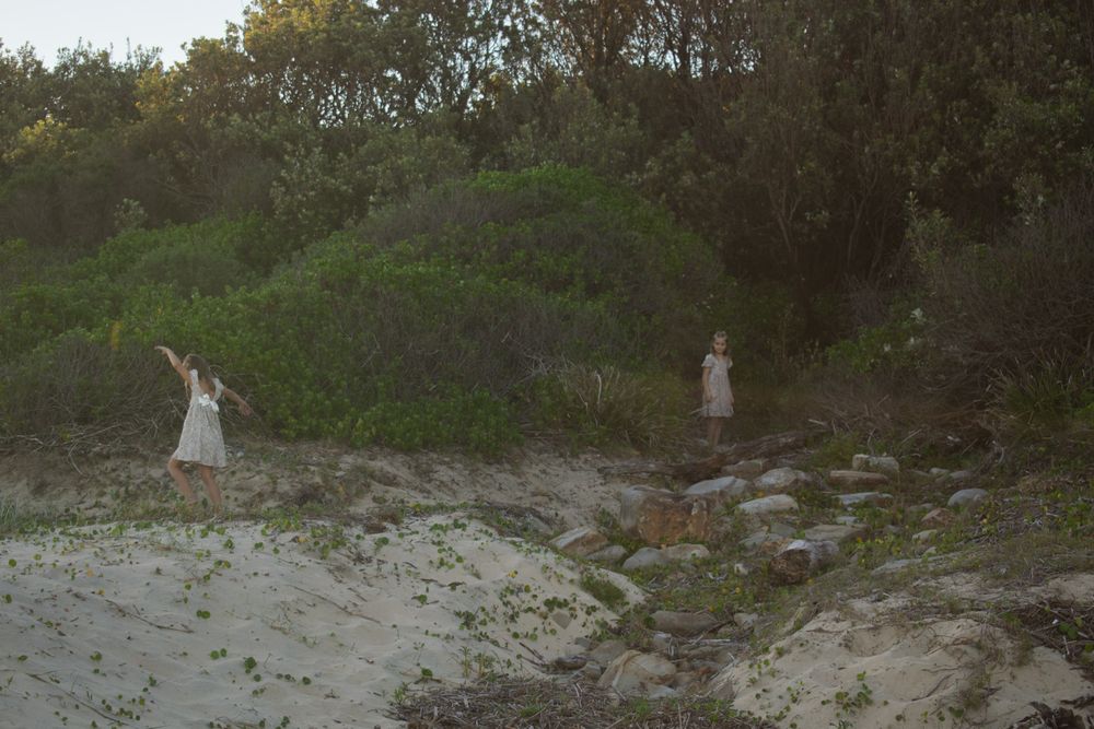 Newcastle family photographer capturing a family exploring on the beach