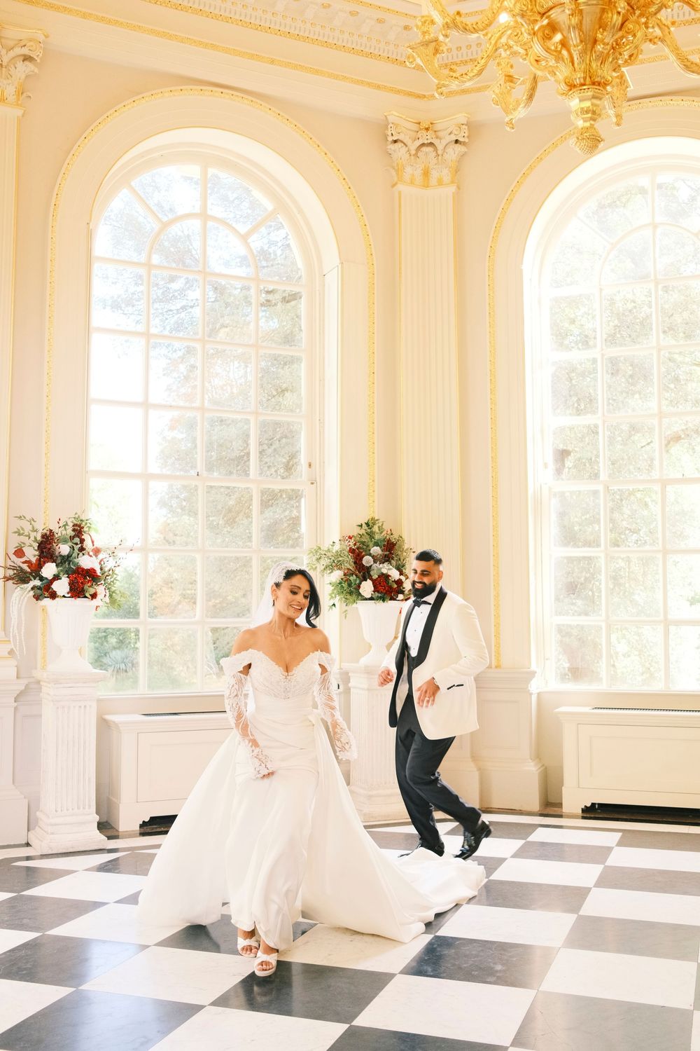 Editorial couple portrait on the checkered floor of the Octagon Room